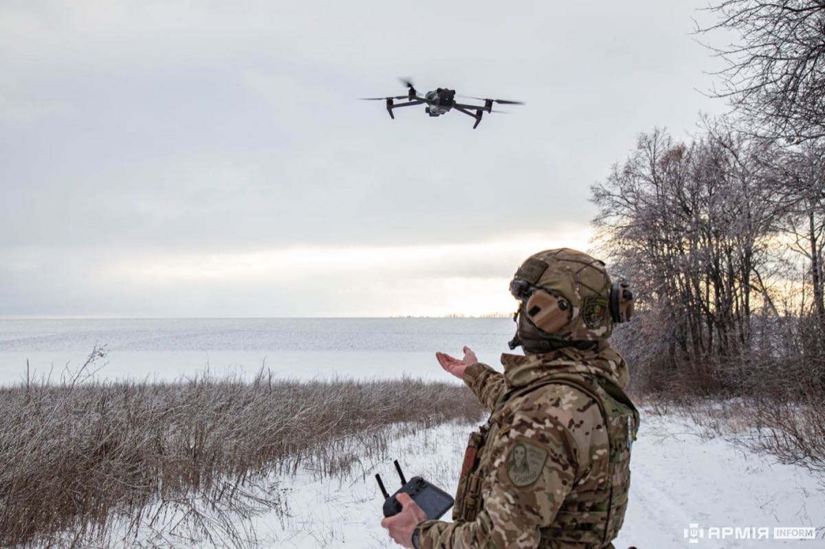 Ukrainian soldier operating a drone
